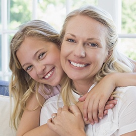 Smiling mother and daughter