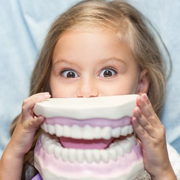 young girl with dental mold