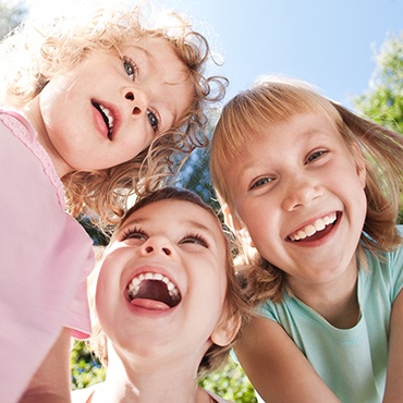 Three smiling young girls