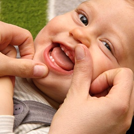 close-up of smiling little boy getting teeth examined
