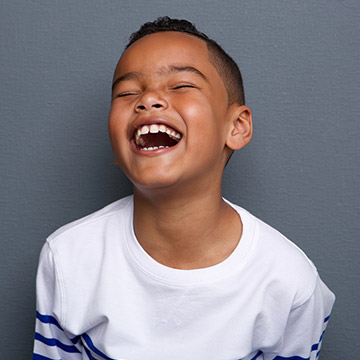 Midland Preventive Dentistry Young boy laughing happily