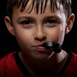 Young boy with athletic mouthguard