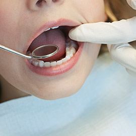 Child receiving dental screening
