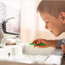 Little boy brushing teeth