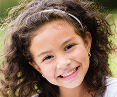 Smiling little girl with healthy teeth