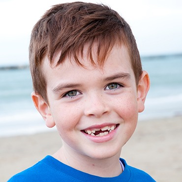 Boy smiling on the beach