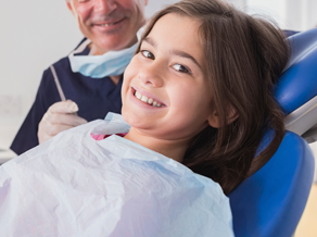 Little girl smiling inside the dental office