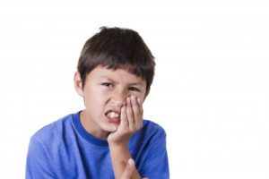 little boy with mouth pain 