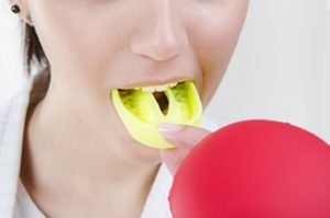 Girl boxing with mouthguard