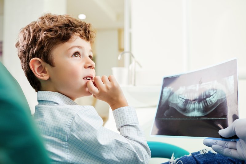 Child viewing X-ray at dental appointment