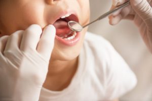 Closeup of child during checkup for pediatric dentistry Midland