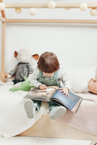 Toddler looking at book