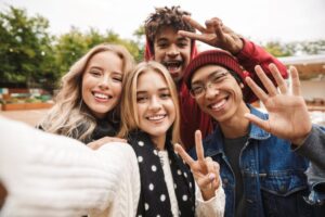 Teen smiling with friends