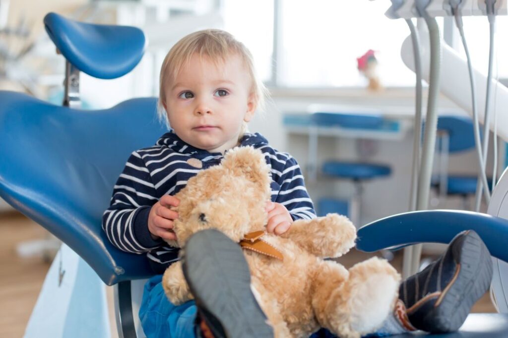 A little boy in a dentist’s chair